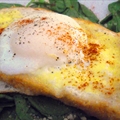 Poached Eggs and Parmesan Cheese Over Toasted Brioche with Pistou