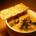 White Bean Cauliflower Soup topped with roasted walnuts and fresh parsley