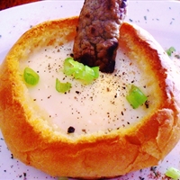 Baked Eggs in Bread Bowls