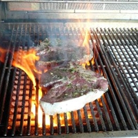 Grilled Porterhouse Steak Marinated In Garlic, with Paprika Parmesan Butter