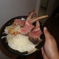 Herb-crusted Rack Of Lamb with Red Onions and Potatoes Au Gratin Herb-crusted Rack Of Lamb with Red Onions and Potatoes Au Gratin