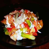 Mushroom ravioli with crab, asparagus, tomatoes and white wine cream sauce
