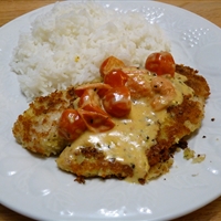 Parmesan Crusted Tilapia With Tomato and Basil Cream Sauce