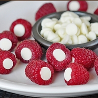 Rasberries with chocolate inside them, easy, quick party desert idea! Rasberries with chocolate inside them, easy, quick party desert idea!
