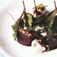 Roast beetroot with baby chard, goat's cheese and walnuts
