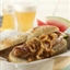 Grilled Bratwurst with Onions Braised in Beer and Mustard