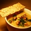 White Bean Cauliflower Soup topped with roasted walnuts and fresh parsley